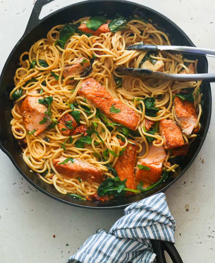 Pasta with lots of salmon fillets and spinach