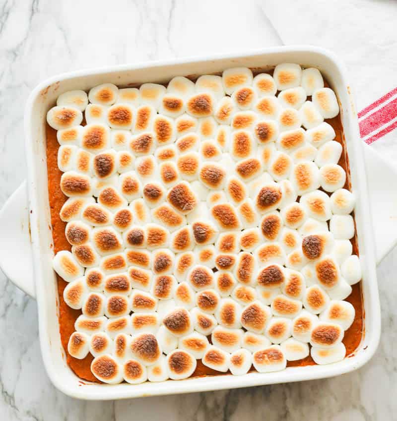 Sweet potato casserole with marshmallows in a square baking dish