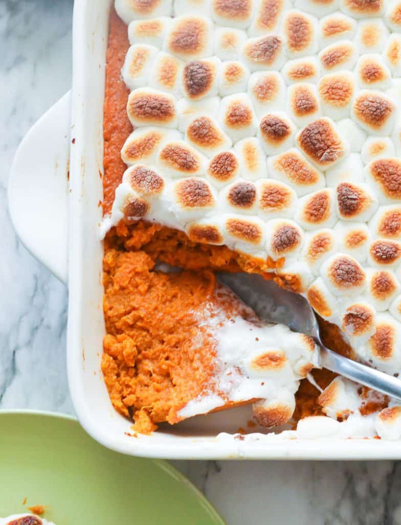 Sweet potato casserole with marshmallows and spoon