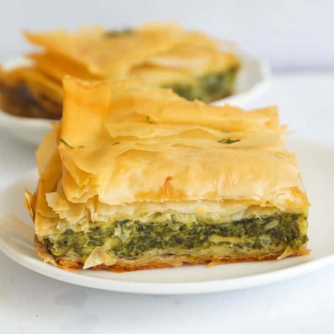 A Slice of Greek Spanokopita or Spinach Pie on a Plate