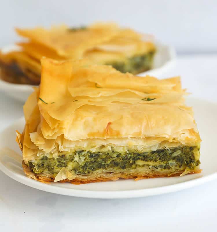 A Slice of Greek Spanokopita or Spinach Pie on a Plate