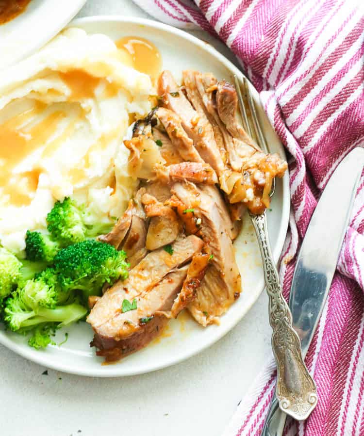Sliced Roasted Turkey Thighs Served with Mashed Potatoes and Broccoli