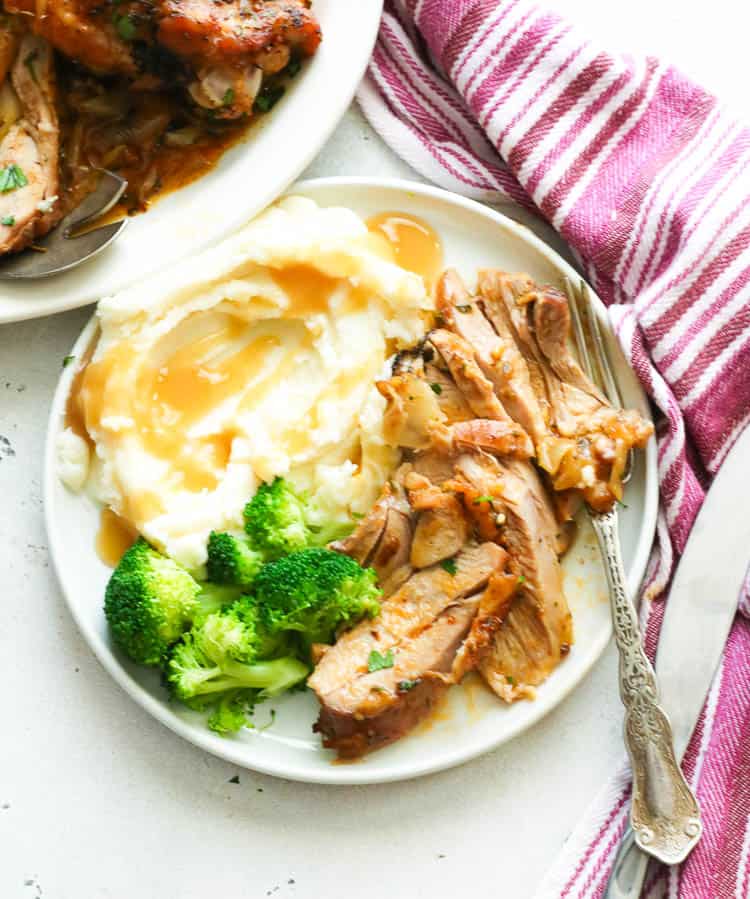 Dinner with roasted turkey, mashed potatoes, and broccoli.