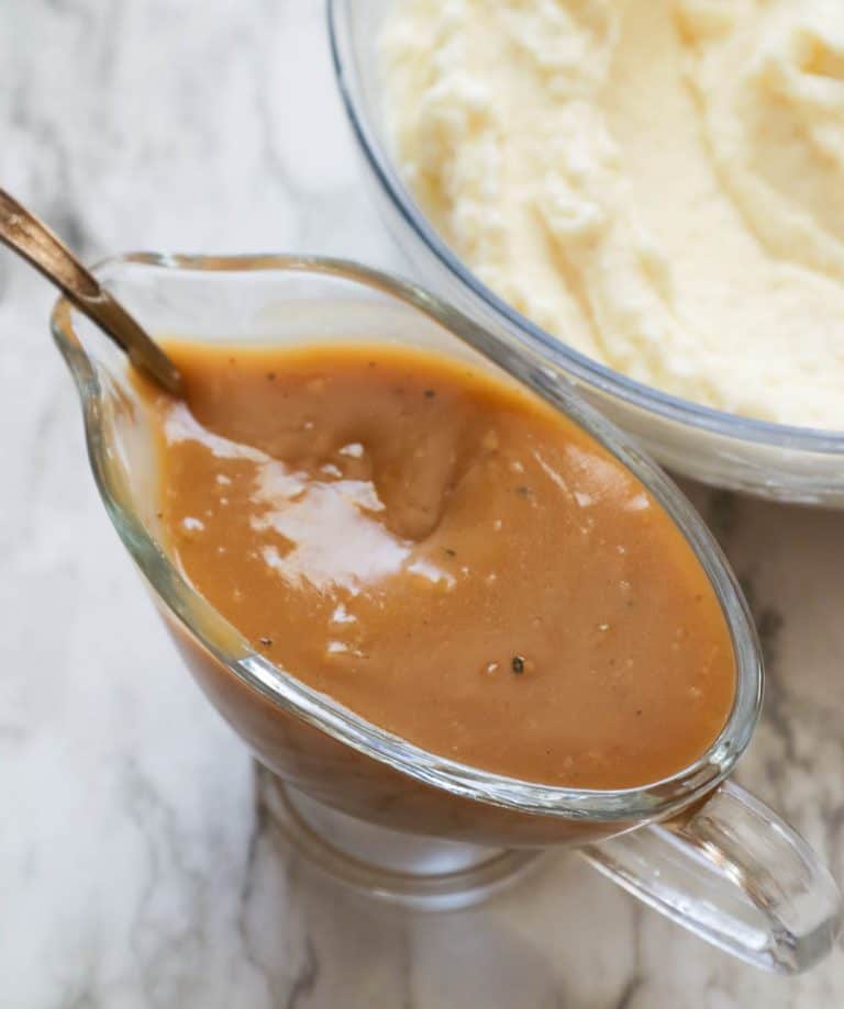 Brown Gravy in a gravy boat ready to dress mashed potatoes