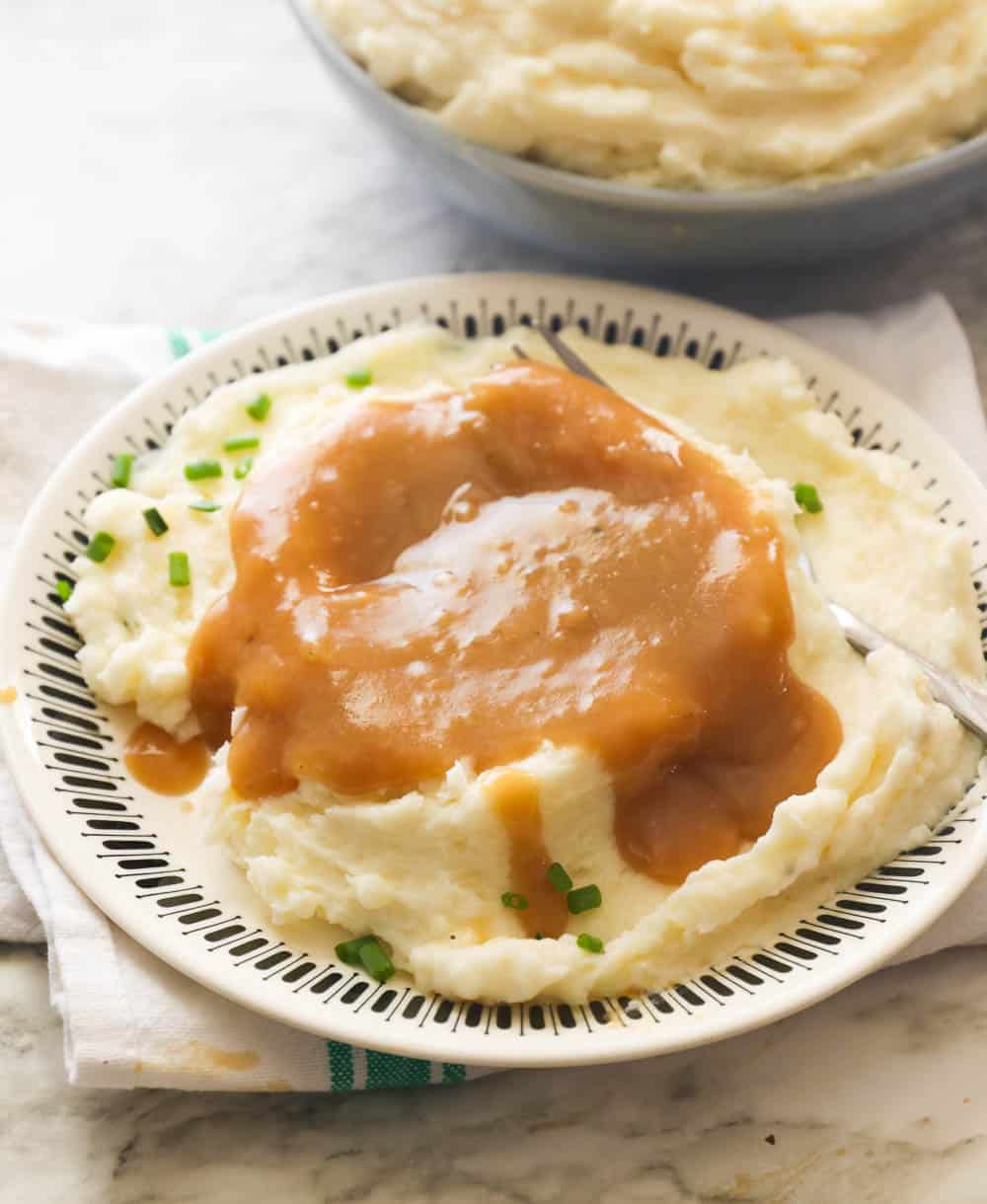 Mashed Potatoes Poured with Brown Gravy