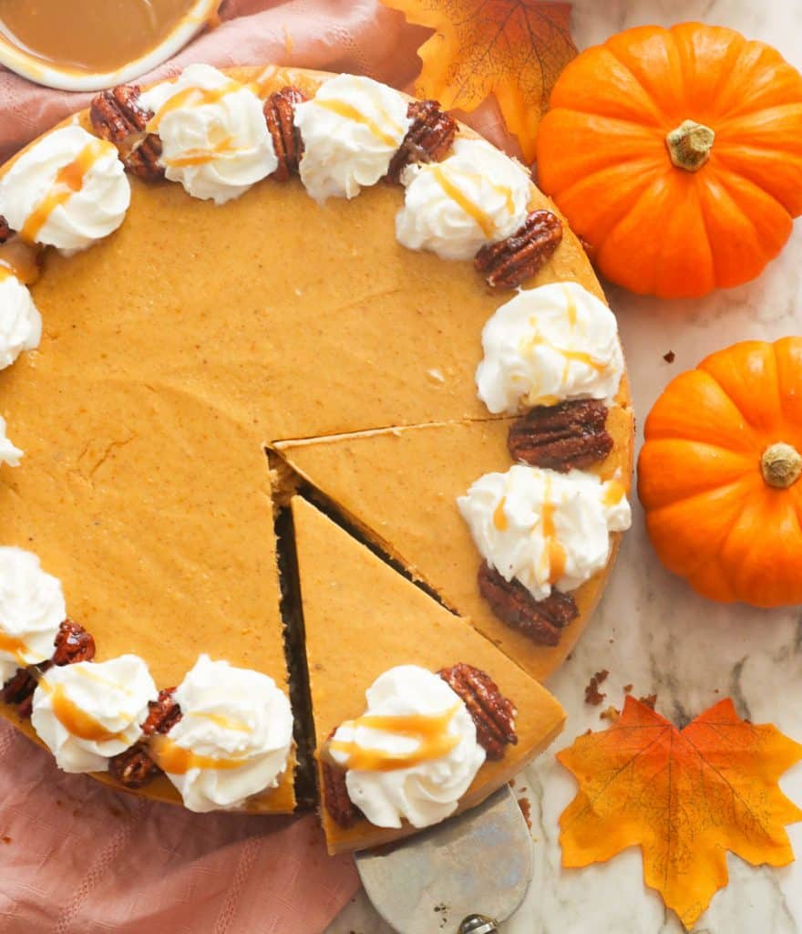 Pumpkin Cheesecake Topped with Pecans and  Whipped Cream