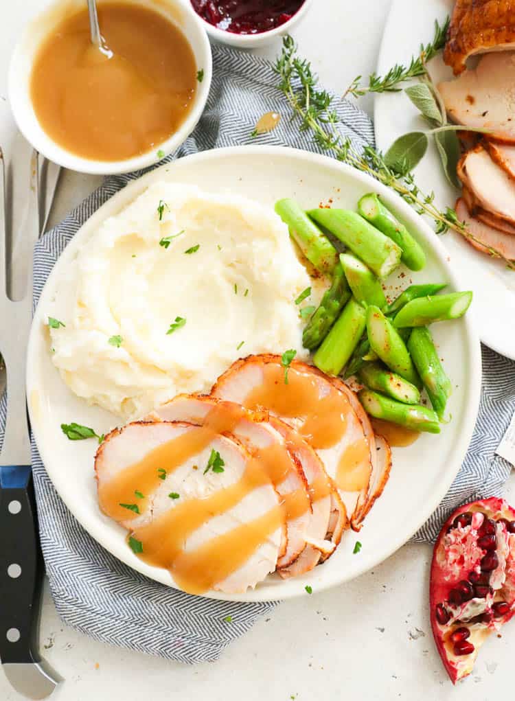 Slices of Smoked Turkey Breast Served with Mashed Potatoes and Gravy