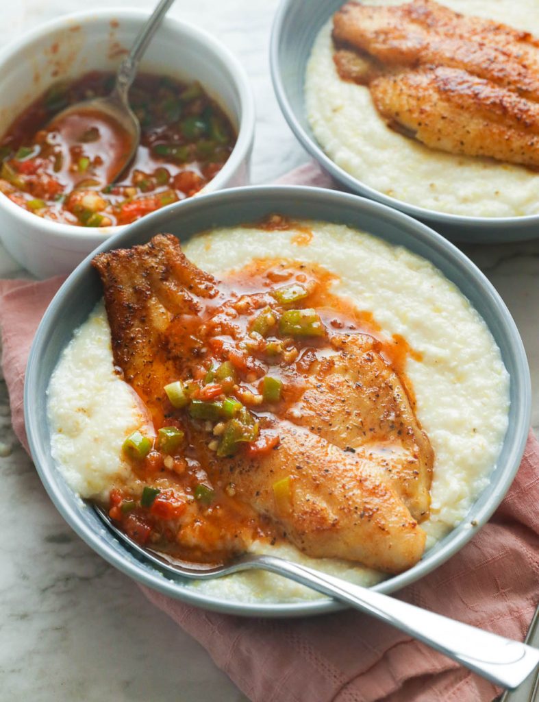 Two servings of grits with fish