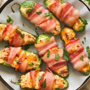 A plate of bacon wrapped jalapeno poppers