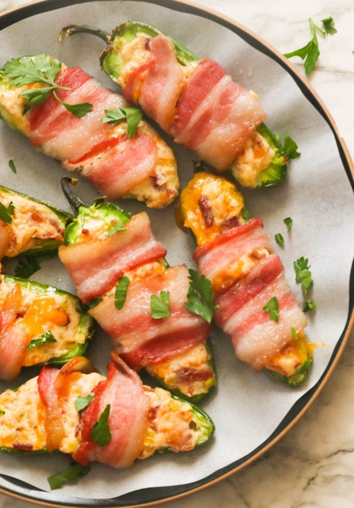 Freshly baked bacon wrapped jalapeno poppers