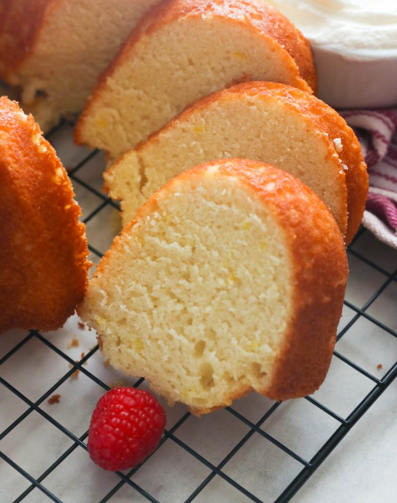 Slices of Old-fashioned milk cake with raspberry on the side