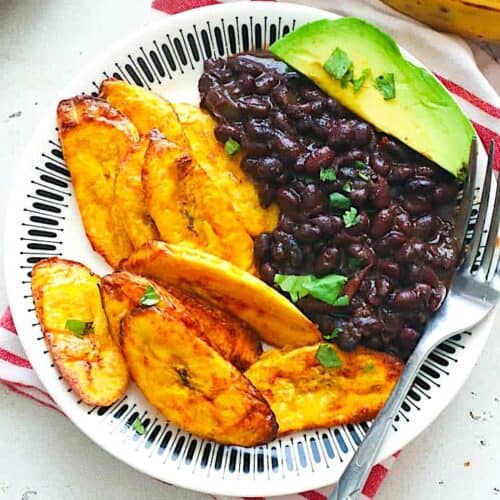 Air fried plantains with black beans and avocado for a healthy vegetarian dinner.