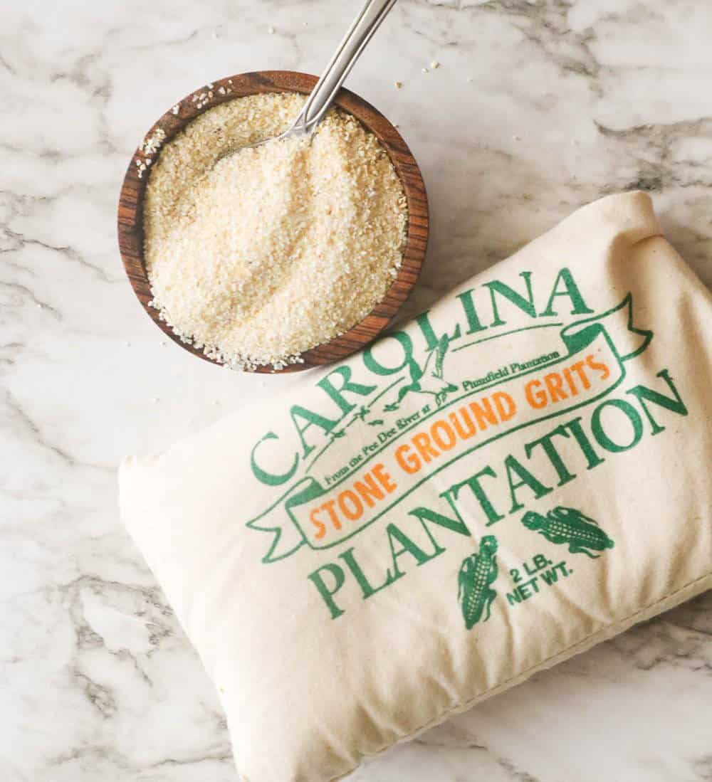 A bag of stone-ground grits with a cupful