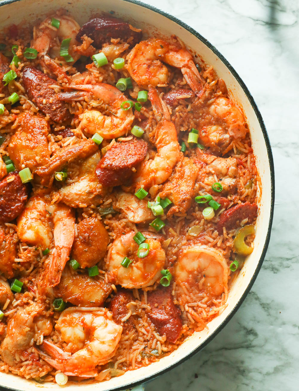 A pan of freshly cooked jambalaya with shrimp, sausages, and chicken.