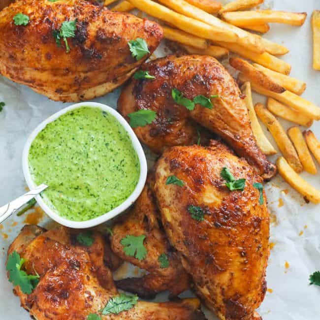 Peruvian Style Roasted Chicken with green sauce and fries
