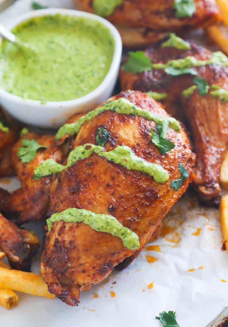 Roast chicken drizzled with Peruvian green sauce