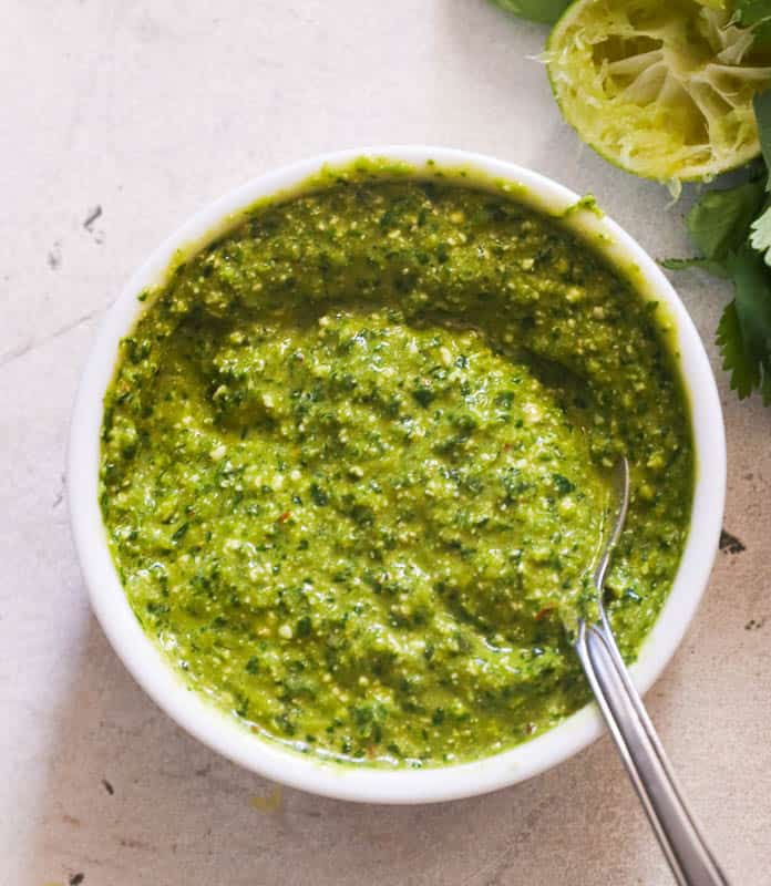 A bowl of spicy green sauce