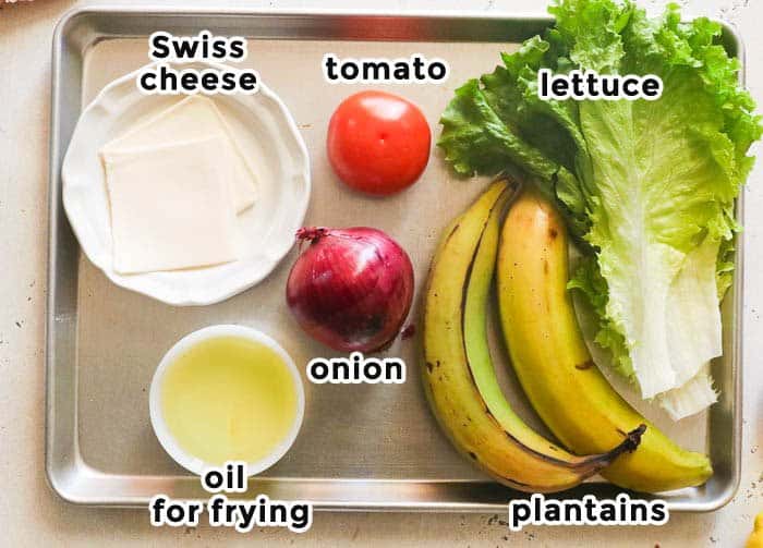 jibarito plantain steak sandwich ingredients on a sheet pan