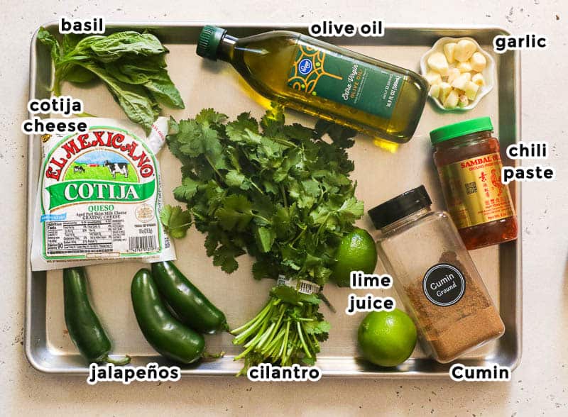 peruvian green sauce ingredients on a sheet pan