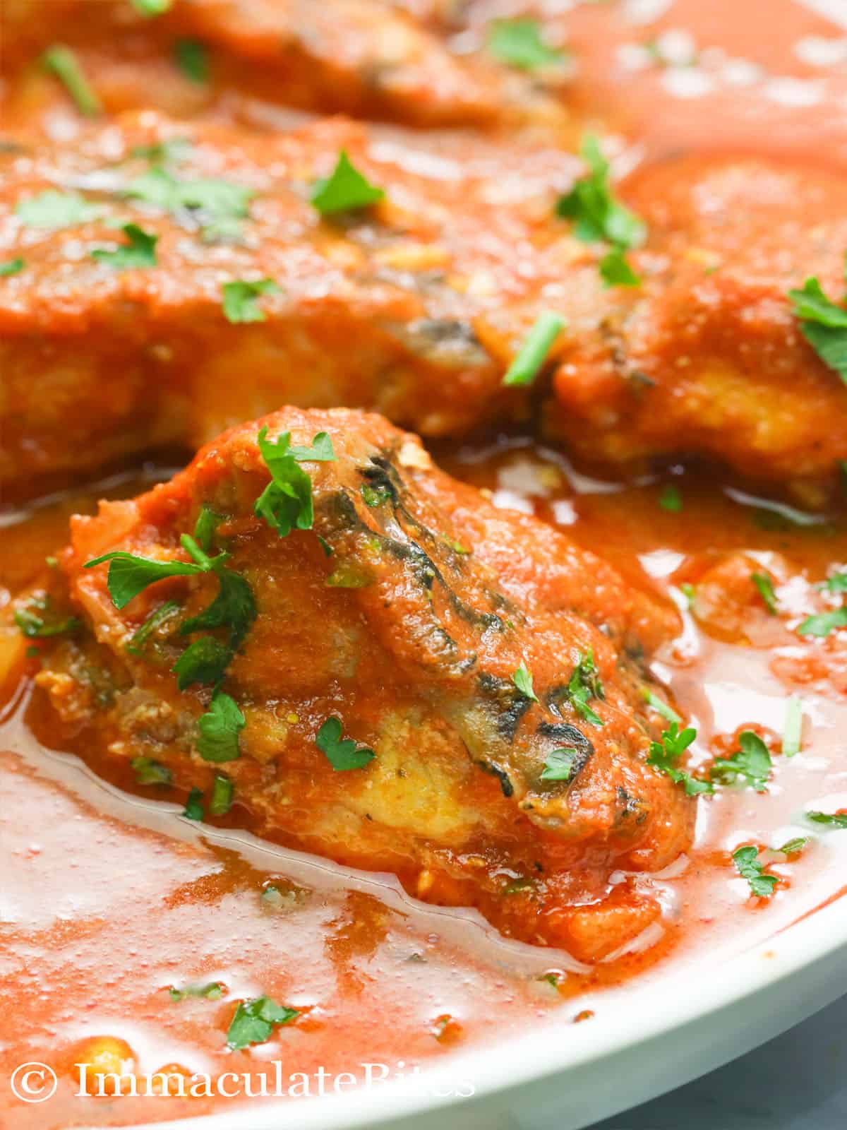 A Slice of Fish Stew in a Plate Garnished with Parsley