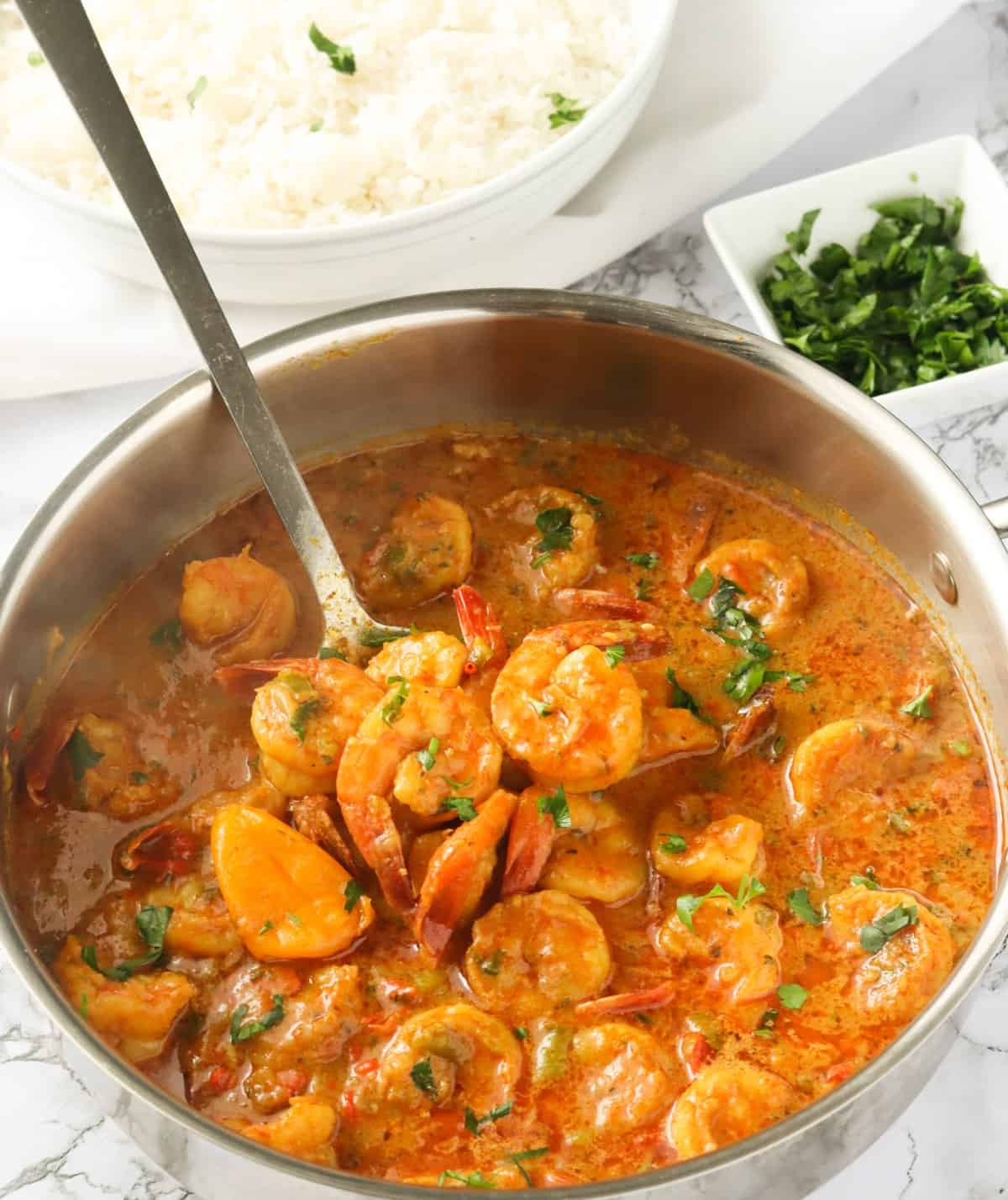 A Pot of Jamaican Curry Shrimp Garnished with Parsley
