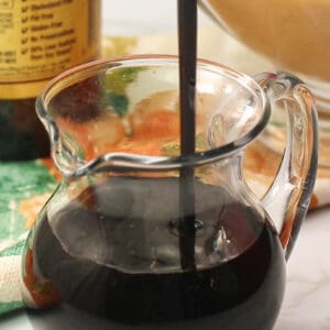 Browning sauce being poured into a pitcher