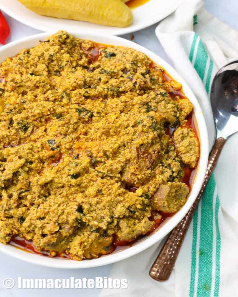a bowl of egusi soup with plantains in the background