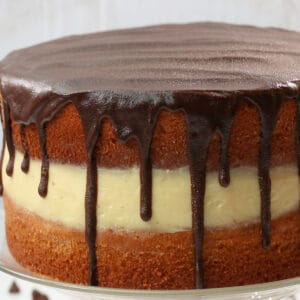 Full Shot of Boston Cream Pie on a Cake Stand