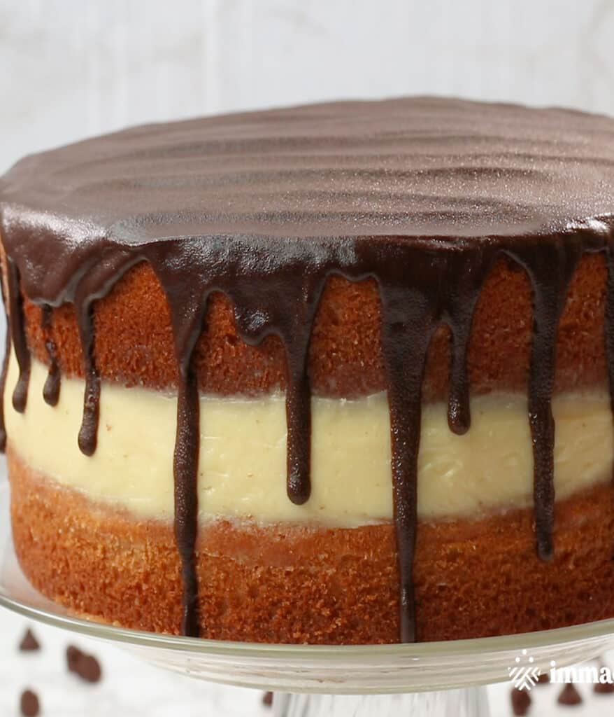 Full Shot of Boston Cream Pie on a Cake Stand
