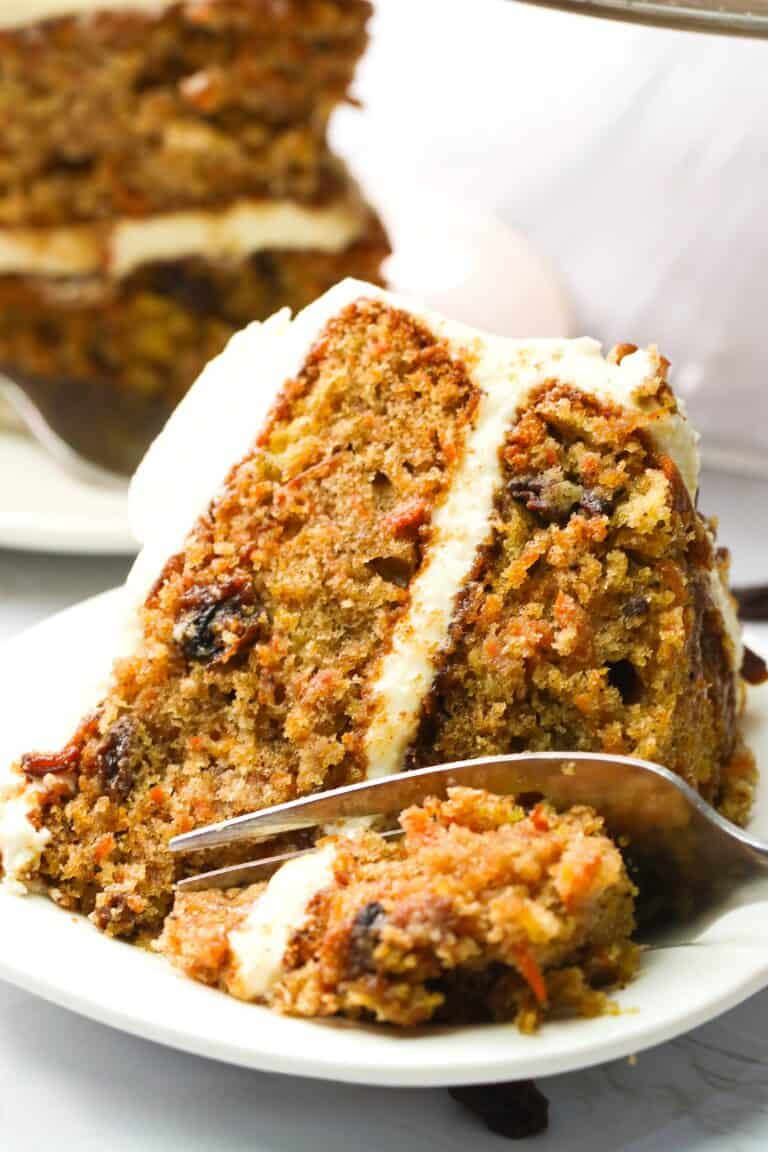 Forking into a decadent slice of carrot cake with crushed pineapple.