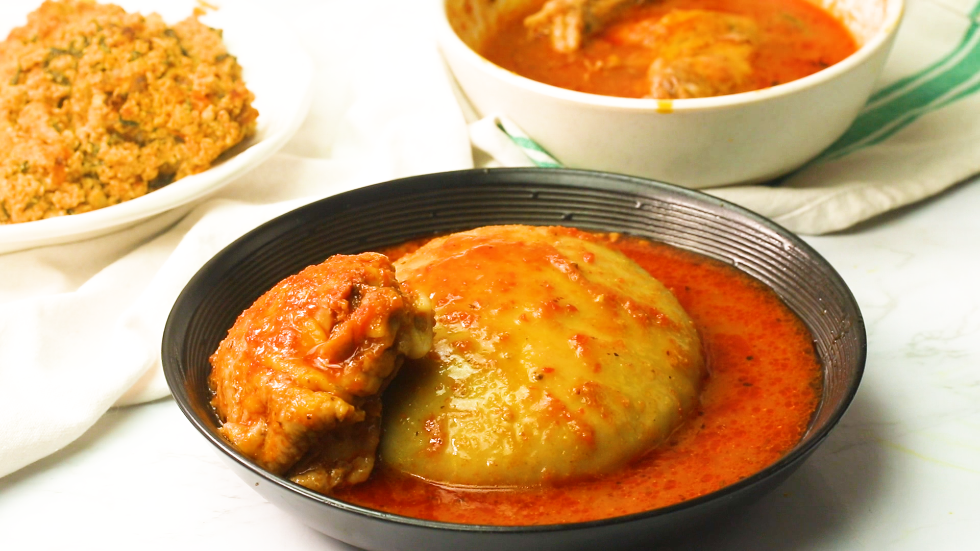 Comforting Fufu in a bowl of red soup for a classic African meal