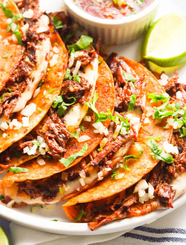 A plateful of beef birria tacos