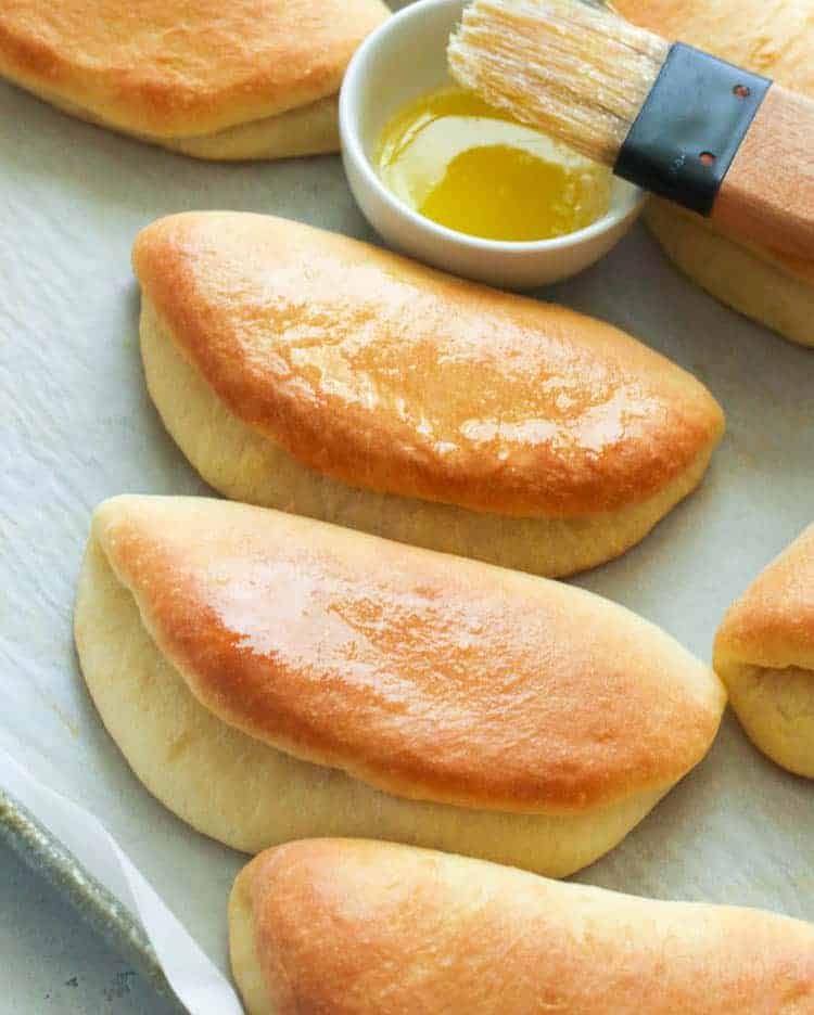Coco Bread fresh from the oven with melted butter make jerk chicken even tastier