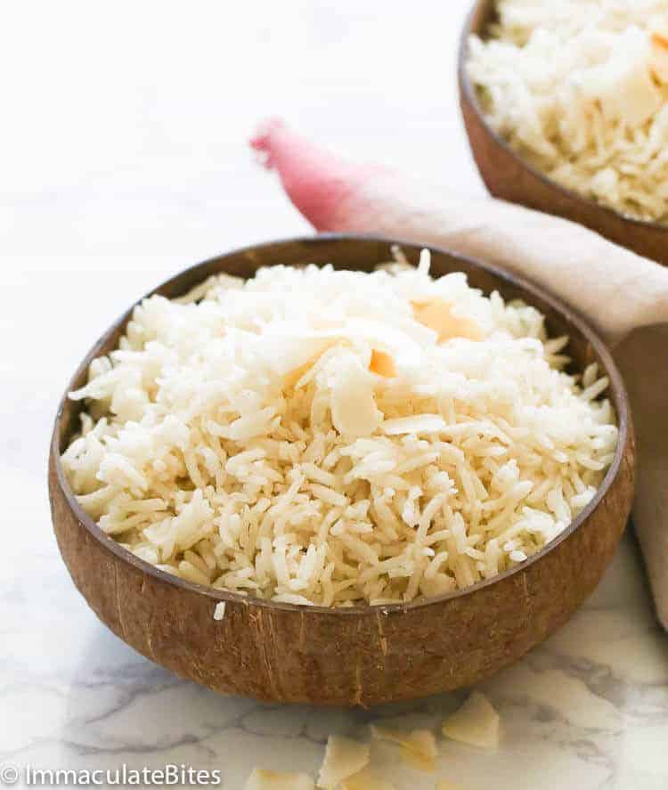 Coconut Rice in a wooden bowl is an ideal side for coconut rice