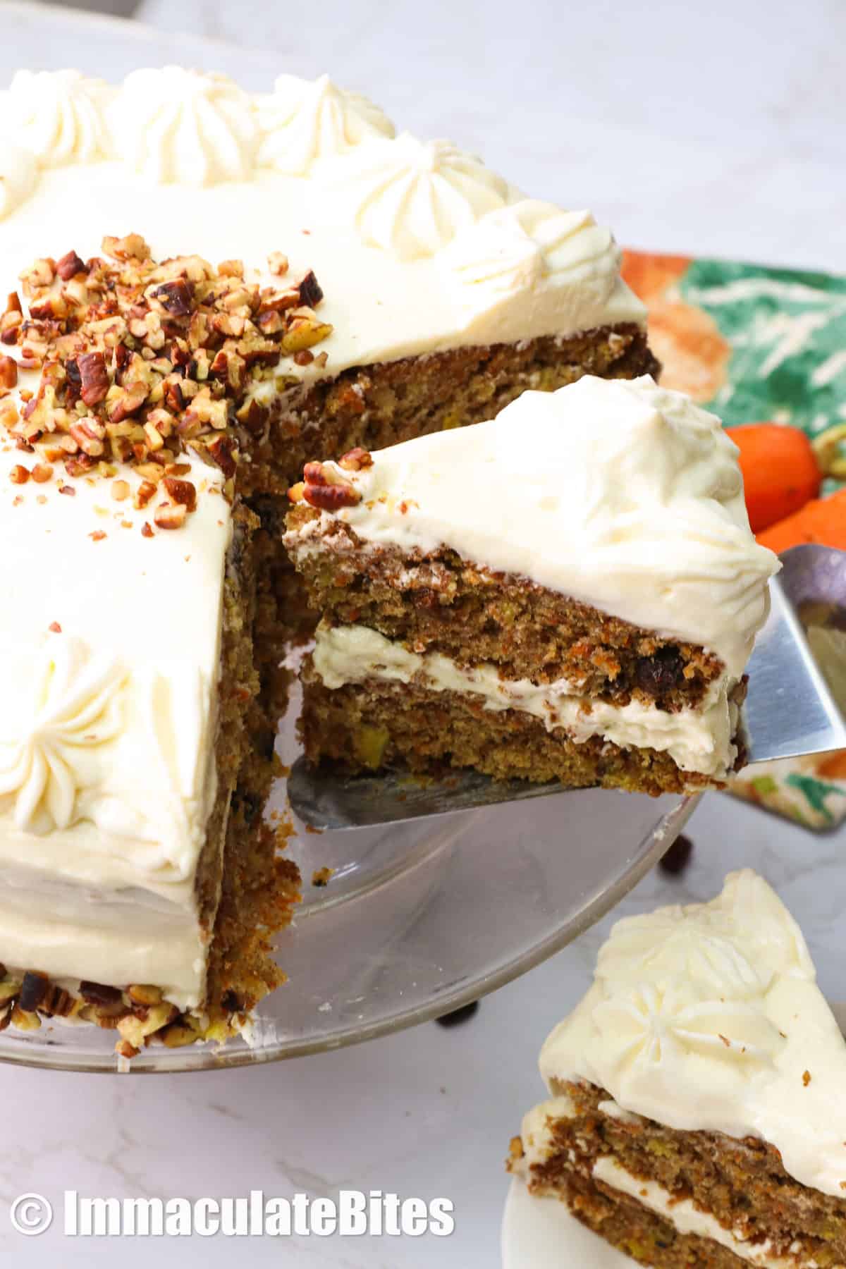 Serving a slice of carrot pineapple cake from a side view