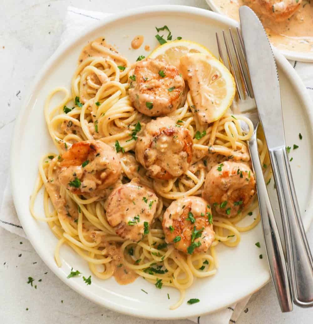 Creamy seafood pasta on a white plate