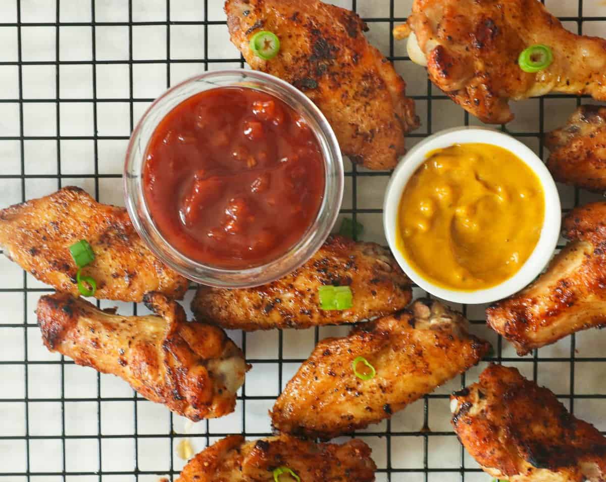 Grilled chicken wings with BBQ and mustard sauce