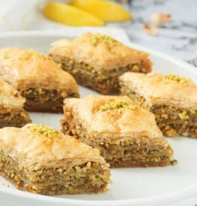 Baklava squares on a white plate