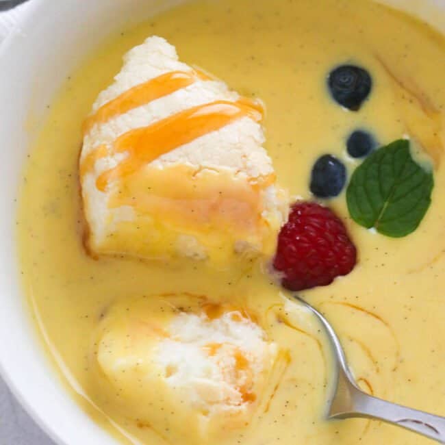 Closeup of of Floating Island dessert with a spoon