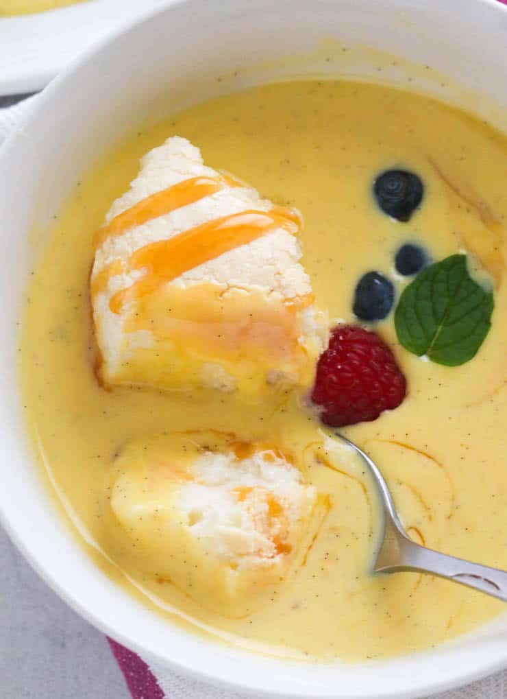 Closeup of of Floating Island dessert with a spoon