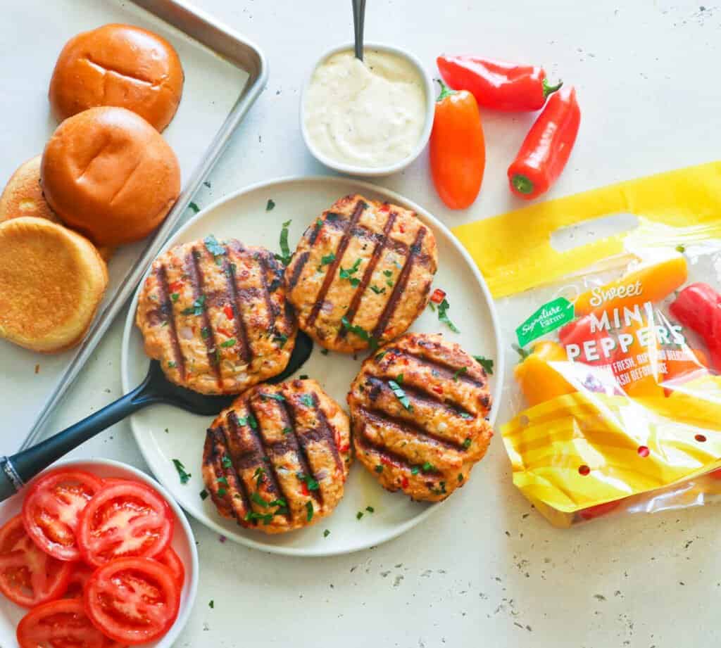 Grilled salmon burgers ready to assemble