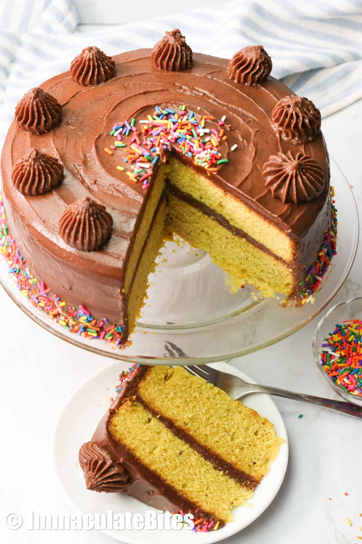 Yellow cake with a slice served