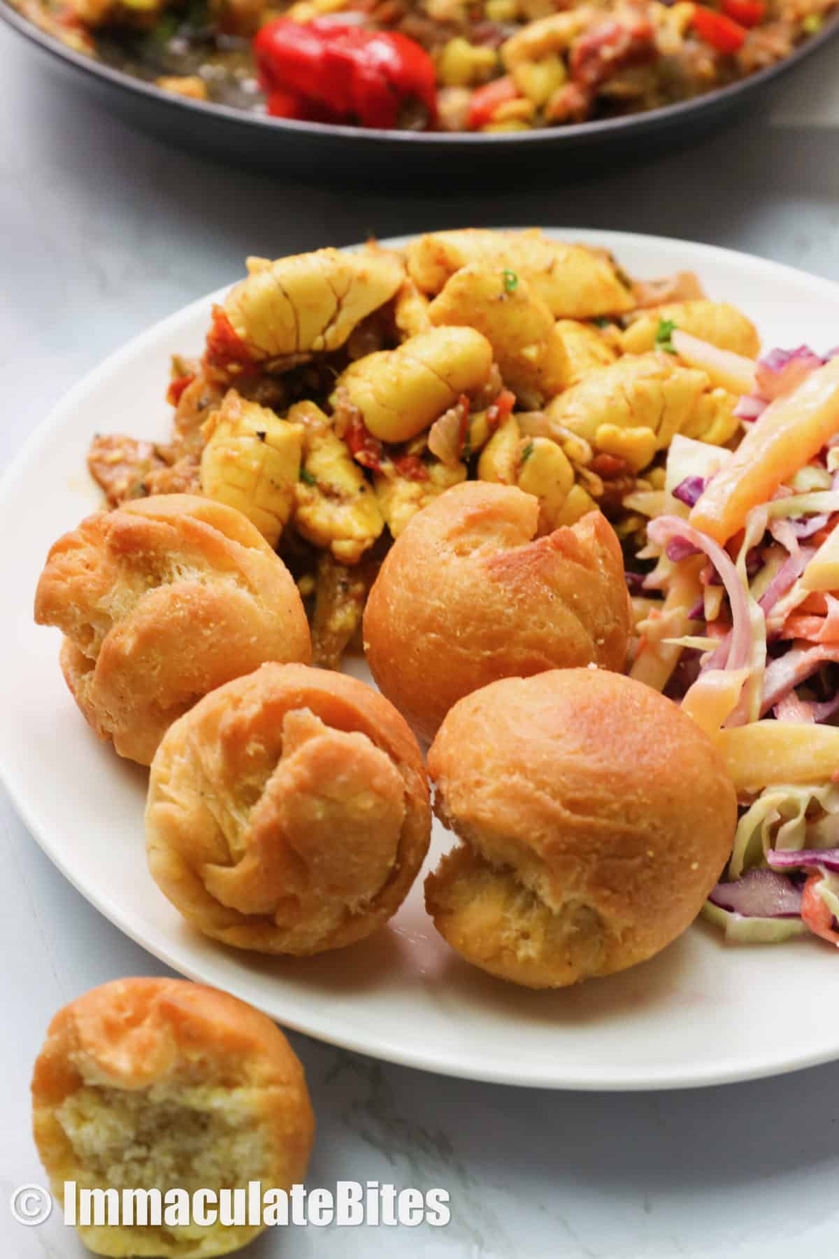 Jamaican Fried Dumplings with mango coleslaw and ackee with saltfish
