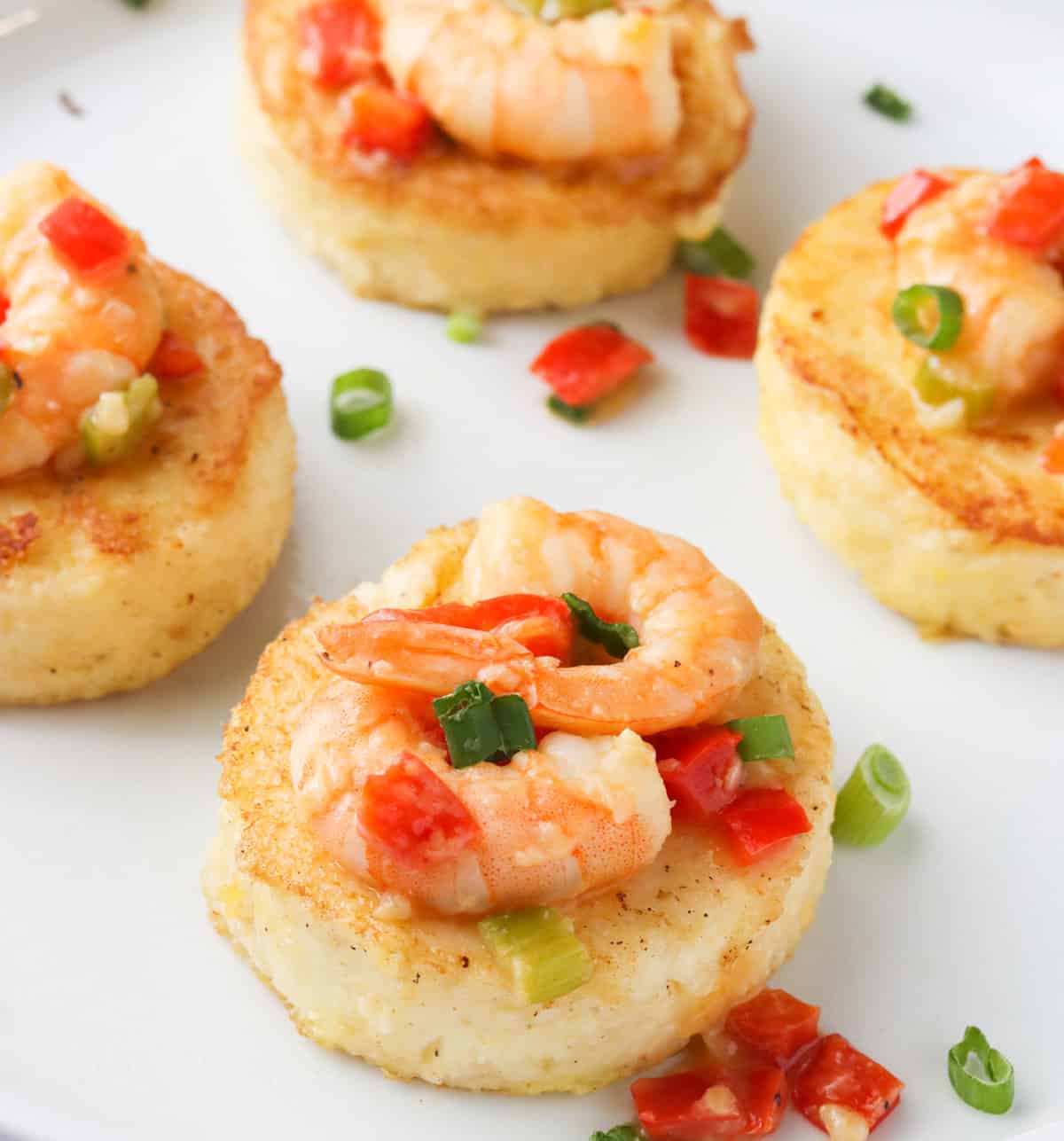 grit cakes with shrimp on top