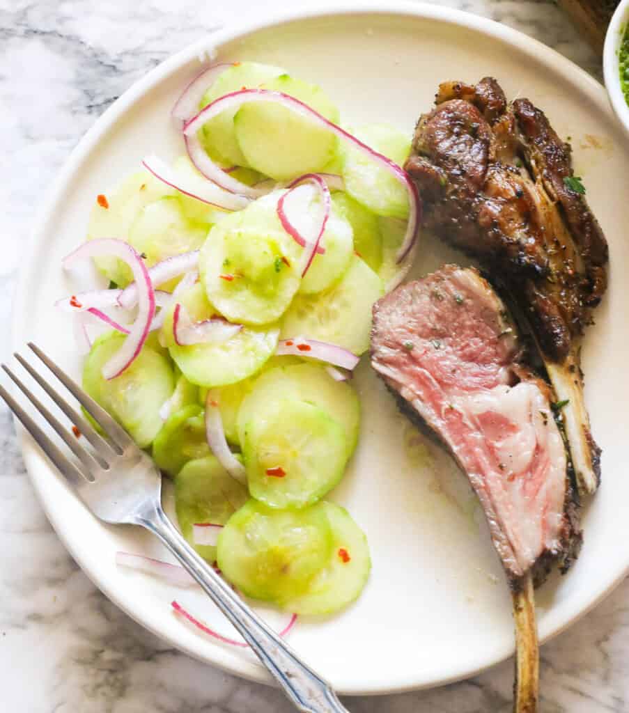 Cucumber and onion salad with grilled lamb