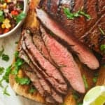 Grilled flank steak sliced perfectly with black bean and corn salad