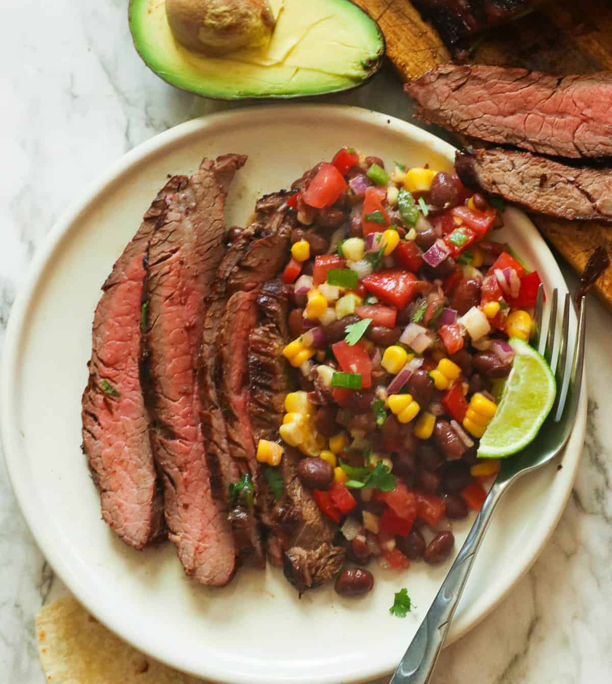 Enjoy Grilled Flank Steak with black bean and corn salad