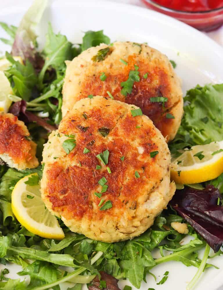 Two tuna patties on a bed of lettuce