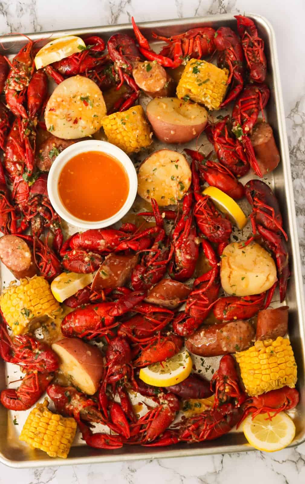 Crawfish Boil on a tray with sauce