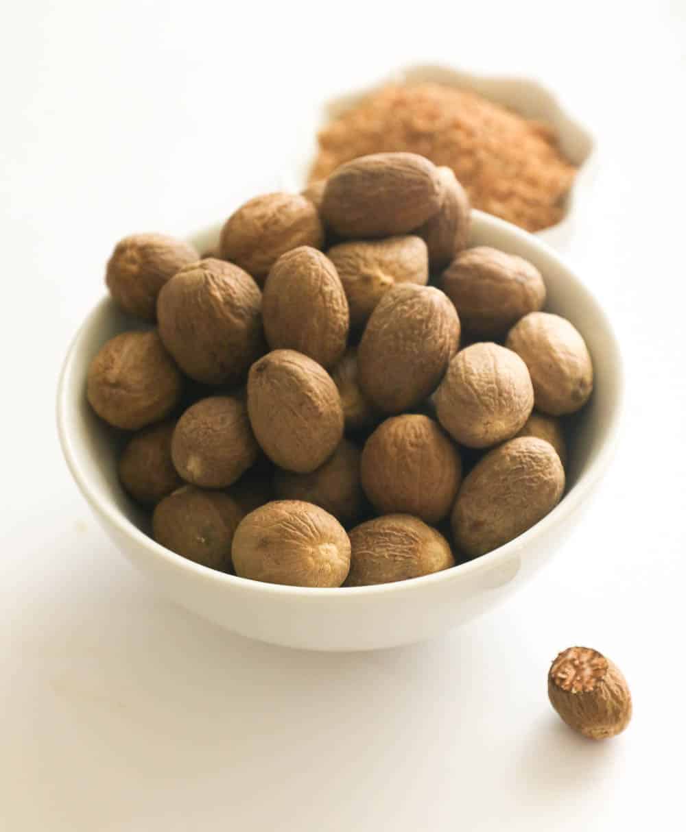 A bowl of whole nutmeg